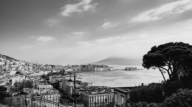 Naples, Italy. Panoramic view from Sant'Antonio to Posillipo of the Gulf of Naples. Mergellina, Castel dell'Ovo, the Lungomare and Viale Gramsci seen from above. Black and white Time Lapse video.