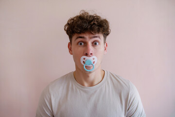 Man with a pacifier in his mouth.