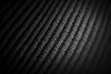Close-up of textured black fabric with diagonal lines.