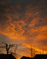 Fototapeta premium heavy clouds lit from below by the setting sun