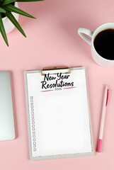 New year resolutions . resolutions list with notebook, coffee cup on pink table. Goals, resolutions, plan, action, checklist concept. New Year template, copy space