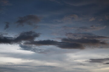 Obraz premium Beautiful dark dramatic sky with stormy clouds before rain or snow. Thunderstorm heaven landscape. Timelapse. 
