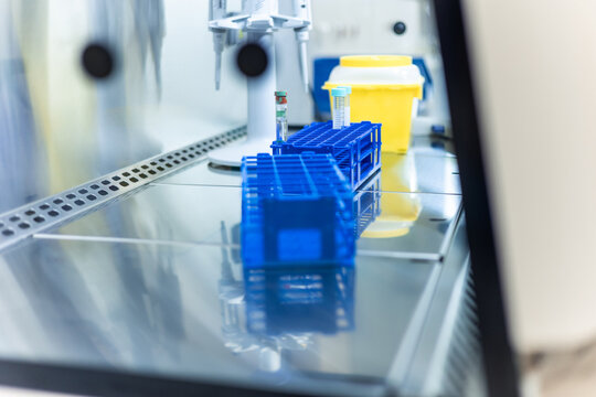 Medical equipment and test tubes inside a sterile laminar flow cabinet