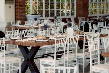 Elegant dining setup in a sunlit room.