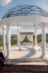 Elegant wedding gazebo with floral decor