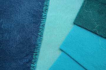 A gradient from cobalt blue to turquoise with a heavy grain texture, giving a strong and dynamic feel.