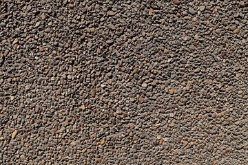 Background, texture wall decorated with small river pebbles