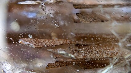 macrophotography of a topaz crystal with plate-like inclusions 1