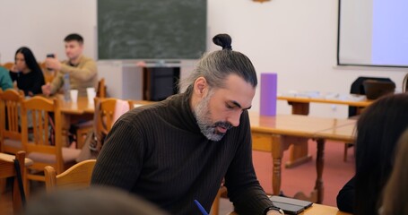 Man in structured workshop prioritizes business objectives for growth, harnessing business mindset...