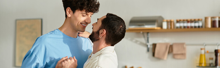 Fototapeta premium Loving moments shared by a gay couple in their modern apartment