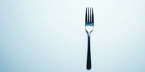 a fork with a black handle