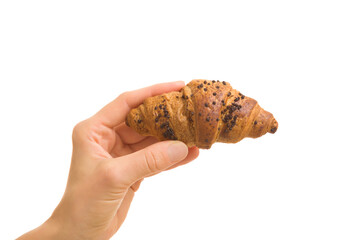 Young adult woman hand holding croissant with dark chocolate sprinkles isolated on white...