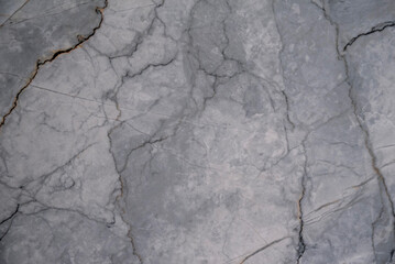 Rugged stone surface with intricate orange and grey natural patterns