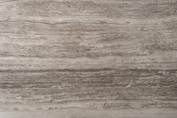 Beige stone surface with horizontal vein patterns and natural texture