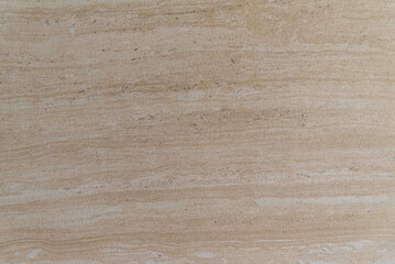 Beige stone surface with horizontal vein patterns and natural texture