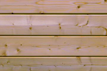 Natural wood surface made of pine horizontal boards as a background. close up