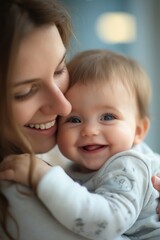 A heartwarming image of a mother joyfully embracing her baby, showcasing love and tenderness in their bond.