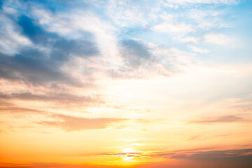 Sky,sunset, beautiful , luxury soft gradient orange gold clouds and sunlight on the blue sky perfect for the background, Sunrise on morning or everning in winter warm time ,Twilight summer,silhouette