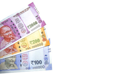 Indian rupees coming from the side on white isolated  background with copy space