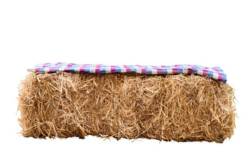 Single rectangle straw bale and soft fabric on top for sit and party decoration isolated on white background with clipping path © ISENGARD