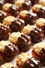 Closeup of handmade Christmas cookies dipped in chocolate