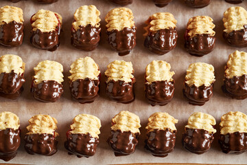 Homemade Christmas cookie filled with marmalade and dipped in chocolate, top view