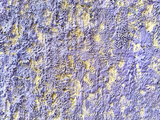 Fototapeta premium Textured wall with a unique pattern and vivid colors ideal for background design or creative projects