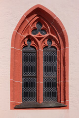 Pointed gothic window arch with trefoil tracery in Niederbrombach, Germany