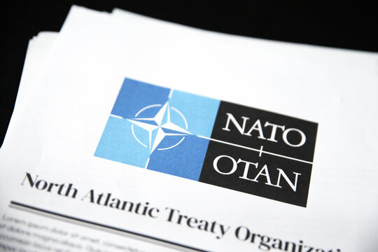North Atlantic Treaty Organization report in paper form showing on black surface, illustrative editorial.
