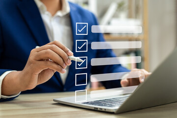 Business performance monitoring and evaluation concept, Take an assessment, Business man using...