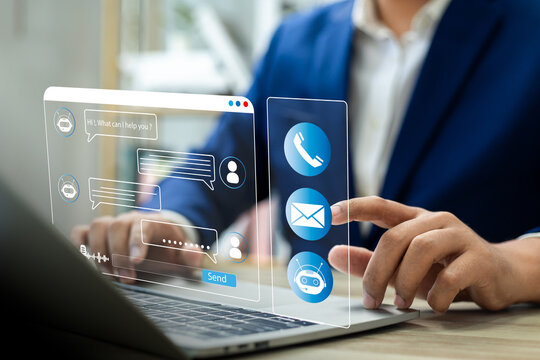 Businessman using AI chatbot conversation assistant in app on device for virtual assistance and customer support digital communication, Contact us Online service with AI Chatbot for efficient support.