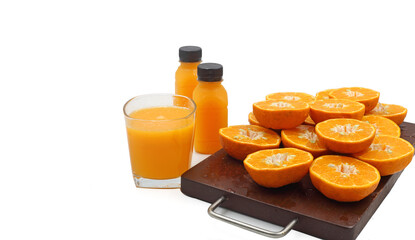 Glass of orange juice and fresh fruits on wooden isolated on white background with copy space