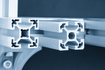 Close up scene the sample parts of aluminum profile extrusion manufacturing concept in the light...
