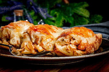 Stuffed pancake baked with cheese.