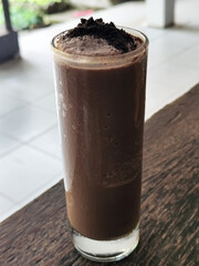 Chocolate milkshake with cream.