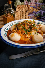 Dumplings with turkey and chorizo sauce.