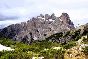 Partly snow-covered mountain landscape in the European Alps and the Italian Dolomites. Mountain peaks around the Three Peaks. Hiking and holidays in the Dolomites, South Tyrol, Italy Mountain panorama