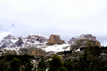Partly snow-covered mountain landscape in the European Alps and the Italian Dolomites. Mountain...