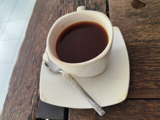 Latte, coffee, Vietnamese coffee served in cups on a wooden table.
