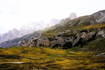 Partly snow-covered mountain landscape in the European Alps and the Italian Dolomites. Mountain...