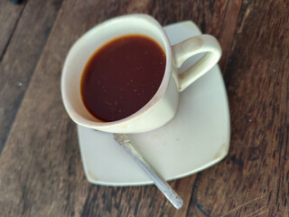 Latte, coffee, Vietnamese coffee served in cups on a wooden table.