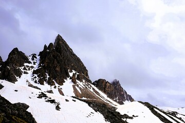 Partly snow-covered mountain landscape in the European Alps and the Italian Dolomites. Mountain...