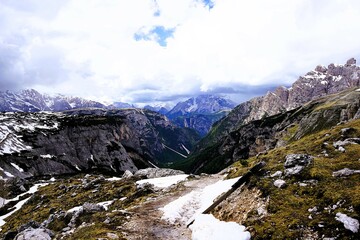 Partly snow-covered mountain landscape in the European Alps and the Italian Dolomites. Mountain...