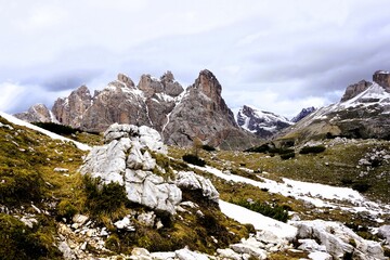 Partly snow-covered mountain landscape in the European Alps and the Italian Dolomites. Mountain...