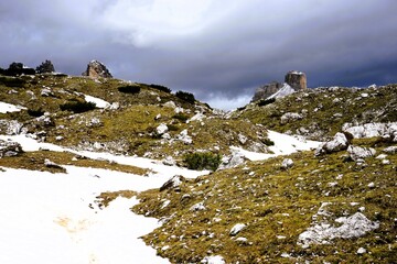 Partly snow-covered mountain landscape in the European Alps and the Italian Dolomites. Mountain...