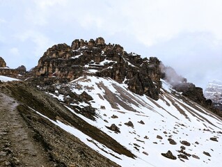 Partly snow-covered mountain landscape in the European Alps and the Italian Dolomites. Mountain...