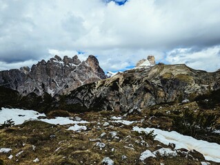 Partly snow-covered mountain landscape in the European Alps and the Italian Dolomites. Mountain...