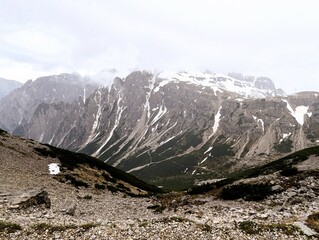 Partly snow-covered mountain landscape in the European Alps and the Italian Dolomites. Mountain...