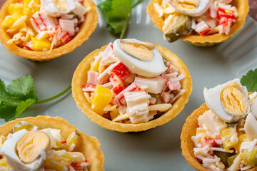 Salad with pineapples and tarts on a plate decorated