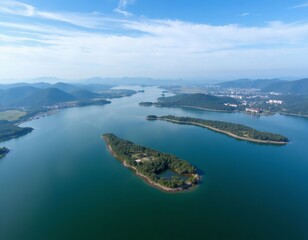Aerial view of lake with islands and mountains in background